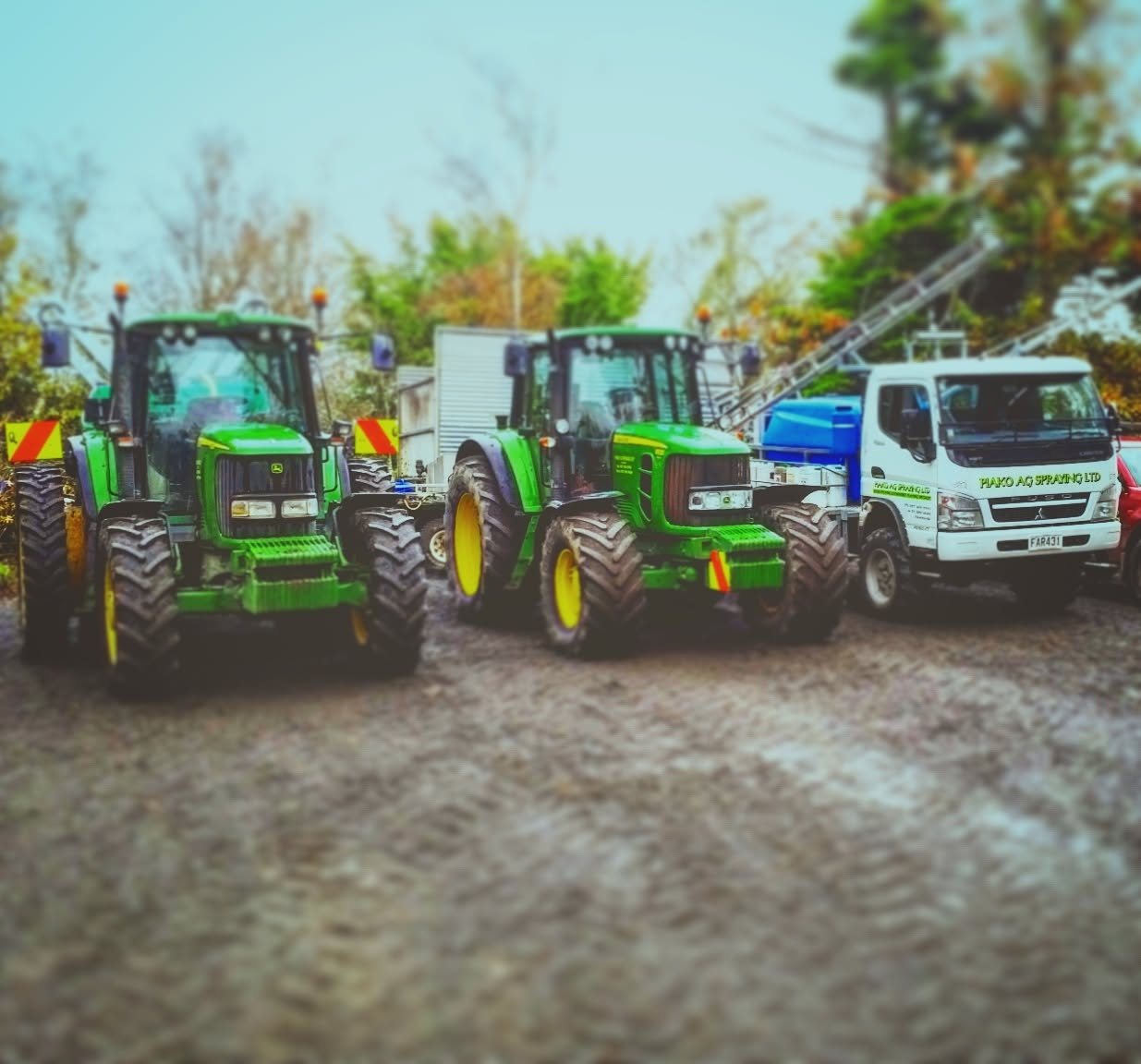 John Deere tractors and the spray truck