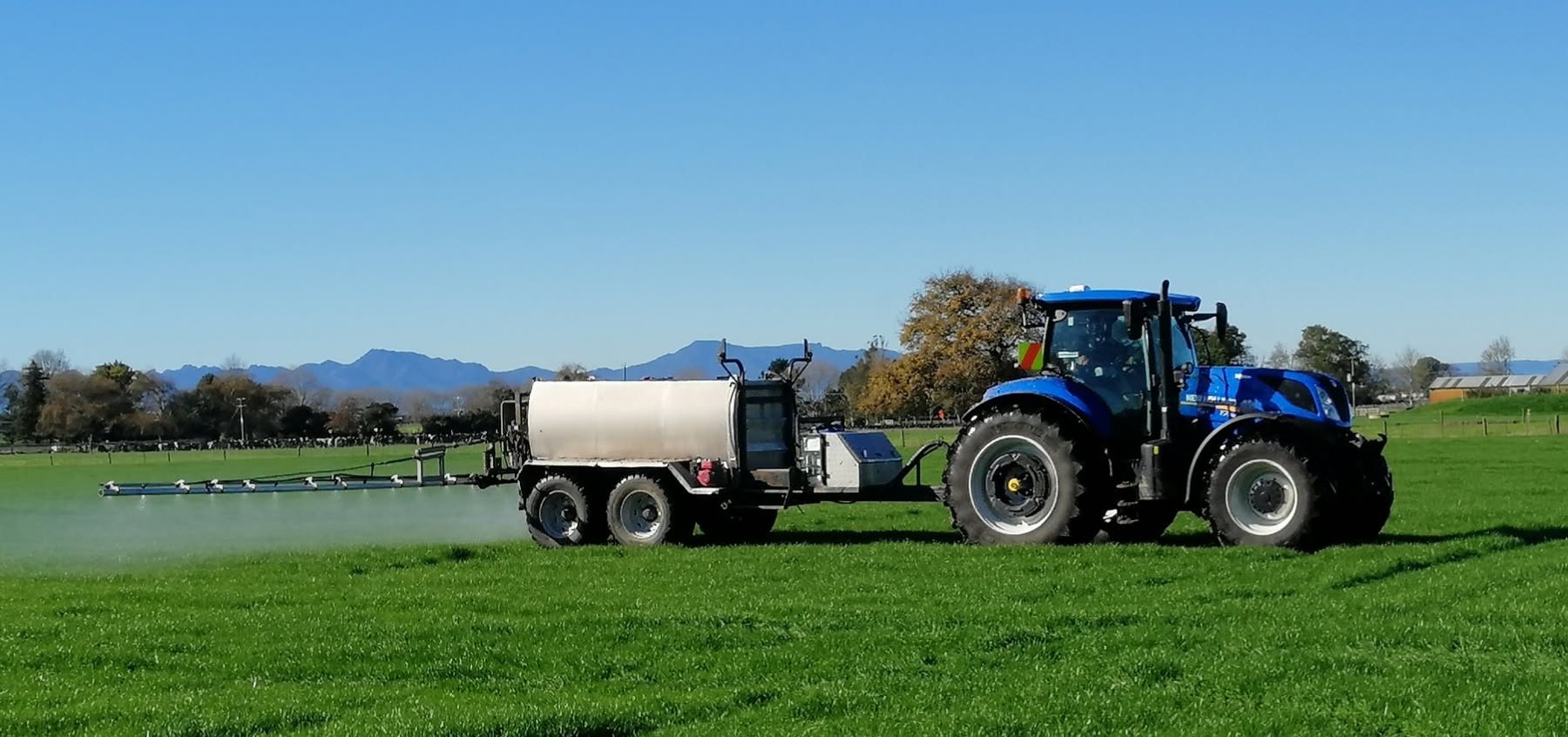New Holland spraying pasture